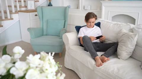 Kid using phone for gaming. boy celebrating victory in video game Stock Footage 115090782