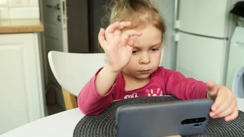 Kid Using Smartphone, Child Browsing Internet, Talking on Smart Phone, Small Stock Footage 192898183