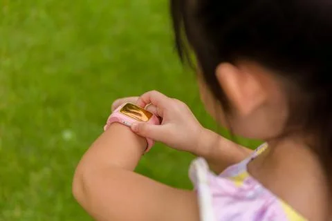 Kid Using Smartwatch or Smart Watch / Kid with Smartwatch or Smart Watch Stock Photos