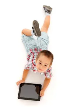 Kid using tablet PC Stock Photos