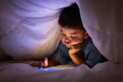 Kid using tablet play learning application games. Stock Photos