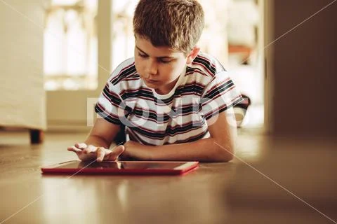 Kid using technology for learning Stock Photos