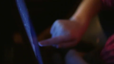 Kid Using Touch Laptop with Blue Glow Close Up of Hand, 4K Stock Footage 61449659