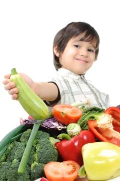 Kid with vegetables Stock Photos