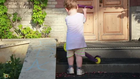 A kid on a walk with a scooter Stock Footage 157182013