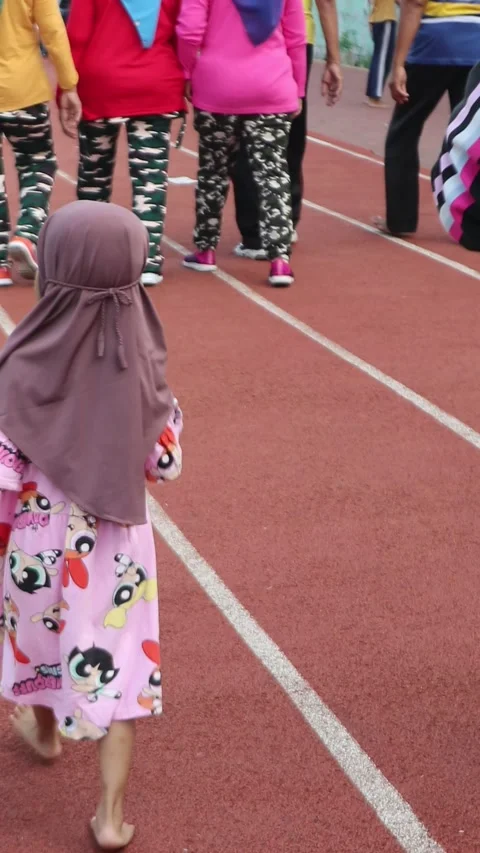 Kid Walking Barefoot People Jogging Track Stock Footage 243047425