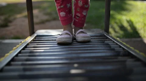 Kid walking on exercise rolling bar equipment Stock Footage 43048304