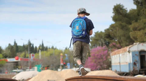 Kid walking on old train tracks Stock Footage 37557870