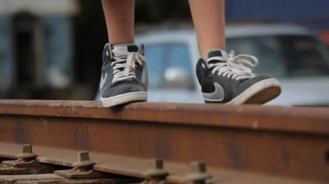 Kid walking on old train tracks Video stock 37558779