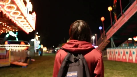 Kid walks alone through carnival 스톡 동영상 80273838