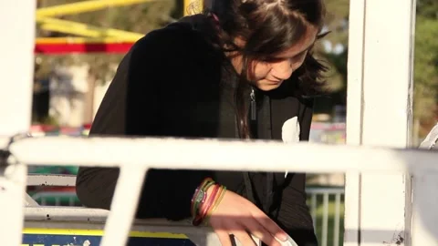 Kid walks up to locked empty ride at carnival Stock Footage 154939986