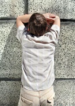 Kid by the Wall Stock Photos
