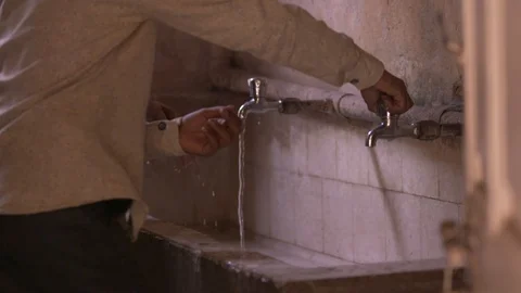 Kid washing hands under tap water in School Stock Footage 90609308