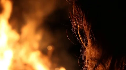 Kid watches the fire burn Stock Footage 122355400