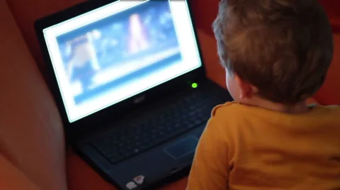 Kid watching cartoon on notebook Video stock 33269793