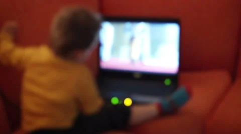 Kid watching cartoon on notebook Stock Footage 33271823