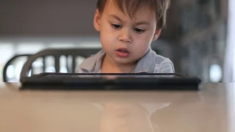 Kid watching electronic tablet, video Video stock 80351687