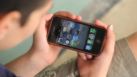Kid watching iphone Stock Footage 37558203