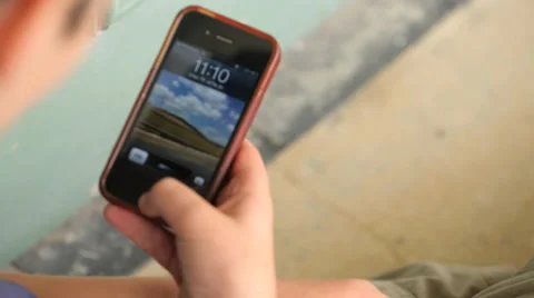 Kid watching iphone Stock Footage 37558583