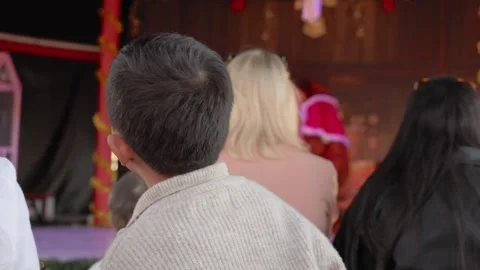 Kid watching a performance for kids. Back view Stock Footage 244828697