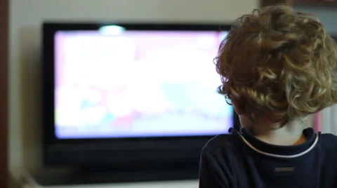 Kid watching tv (back side) Stock Footage 32875175