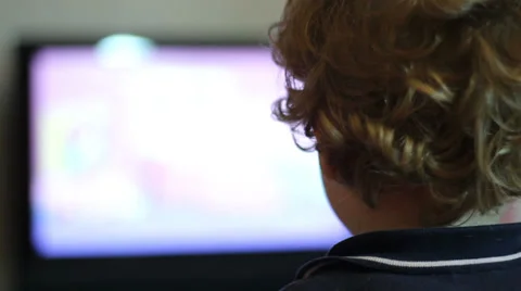 Kid watching tv (back side) Stock Footage 32898529