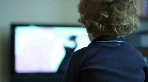 Kid watching tv (back side) Video stock 32901246