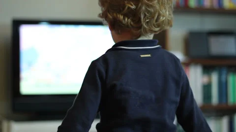Kid watching tv (back side) Stock Footage 32901502
