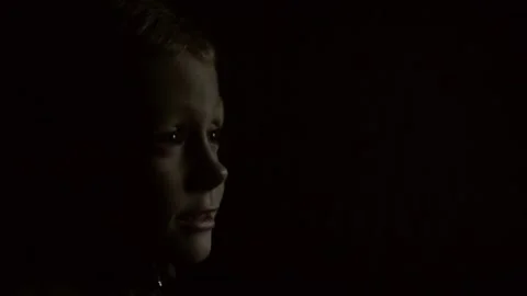 Kid watching TV in the dark Stock Footage 193012469