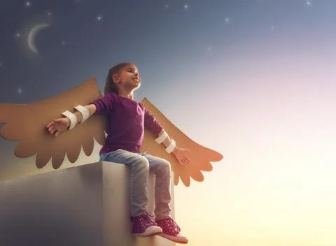 Kid with the wings of a bird Stock Photos