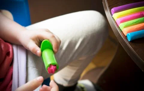 A Kid Working with Plasticine Stock Photos