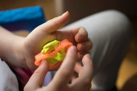 A Kid Working with Plasticine Stock Photos