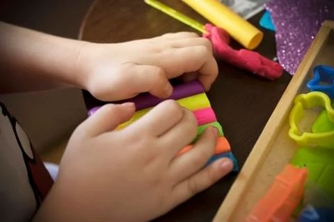 A Kid Working with Plasticine Stock Photos