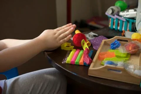A Kid Working with Plasticine Stock Photos
