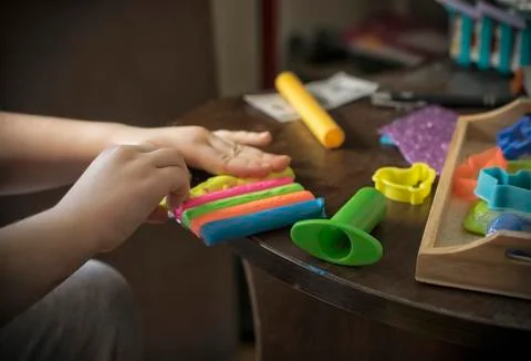 A Kid Working with Plasticine Stock Photos
