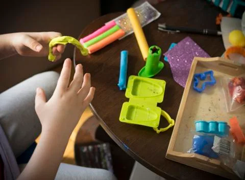 A Kid Working with Plasticine Stock Photos
