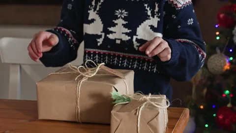 Kid wrapping Christmas presents Stock Footage 219284021