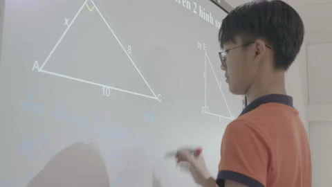 Kid is writing on interactive board Stock Footage 134230128