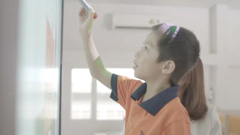 Kid is writing on interactive board Stock Footage 134230253