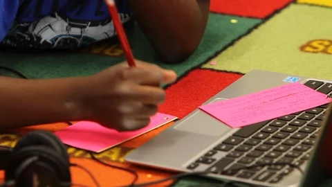 Kid writing notes Stock Footage 92495689