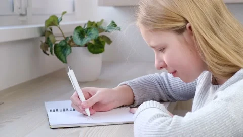 Kid writing or drawing in notebook. Stock Footage 170817605