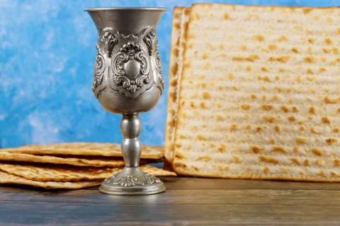 Kiddush cup of wine with matzos bread. Jewish pesah holiday. Stock Photos