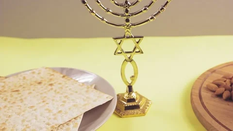 Kiddush wine in a glass, nuts and matzah on the Pesach table Video stock 150325858
