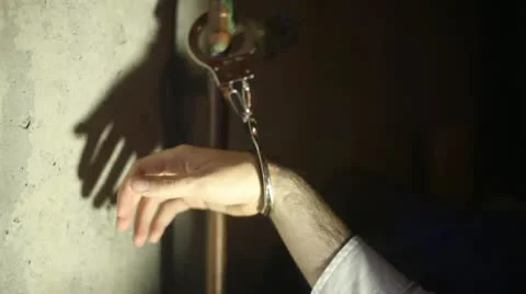 Kidnapped basement prisoner handcuff Stock Footage