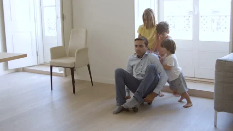 Kids and daddy having fun at home Video stock 150774093
