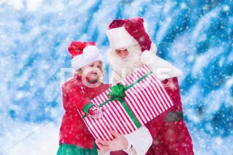 Kids and Santa with Christmas presents Stock Photos
