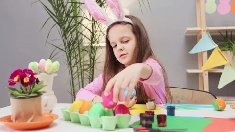 Kid's anticipation of Easter egg decoration. Schoolchild's creative Easter egg Stock Footage 293238891