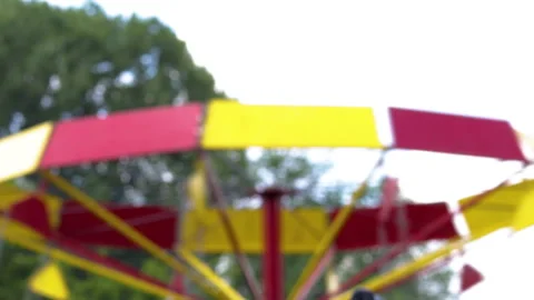 Kids are having fun on carousel in a public park,summer time 库存影片 201242001