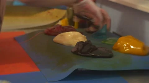 Kids Are Learning to Make Sweets Cut a Piece Off Fix as a Decor to a Caramel on Stock Footage 61545090