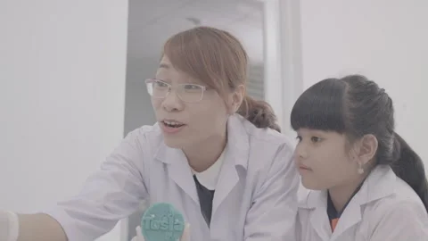 Kids are learning science at laboratory Stock Footage 134225745